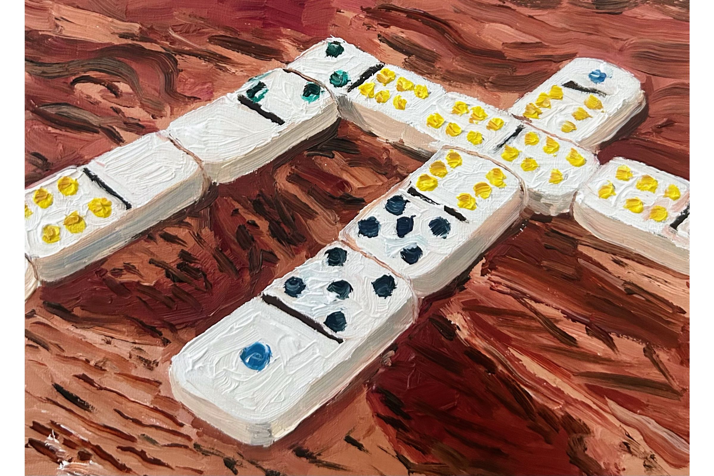 “Dominoes on a wood-grained table” by Kaysi Grimes